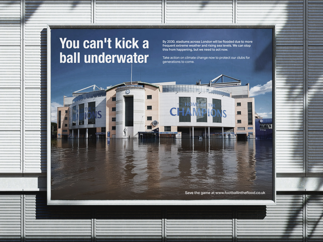 A billboard mockup of a poster showing Chelsea FC's Stamford Bridge football ground/stadium flooded